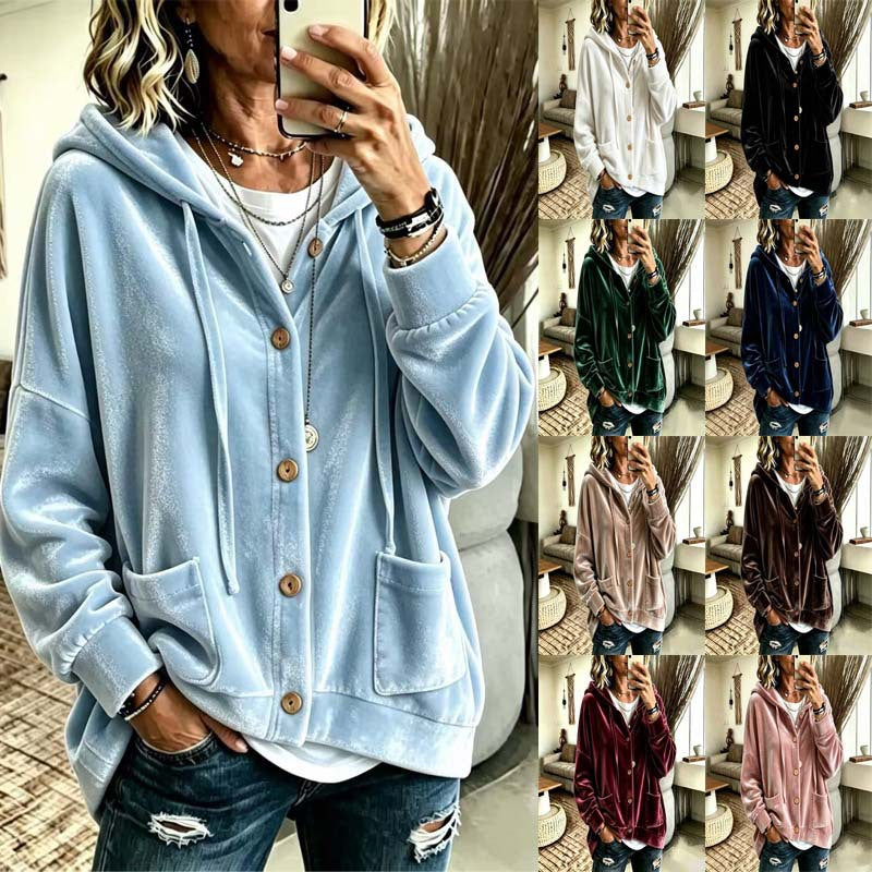 A woman takes a mirror selfie wearing an oversized light blue velour hoodie with a button-front closure and large front pockets. The right side shows a grid of the same hoodie in multiple colors, including white, black, green, navy, beige, brown, burgundy, and pink.