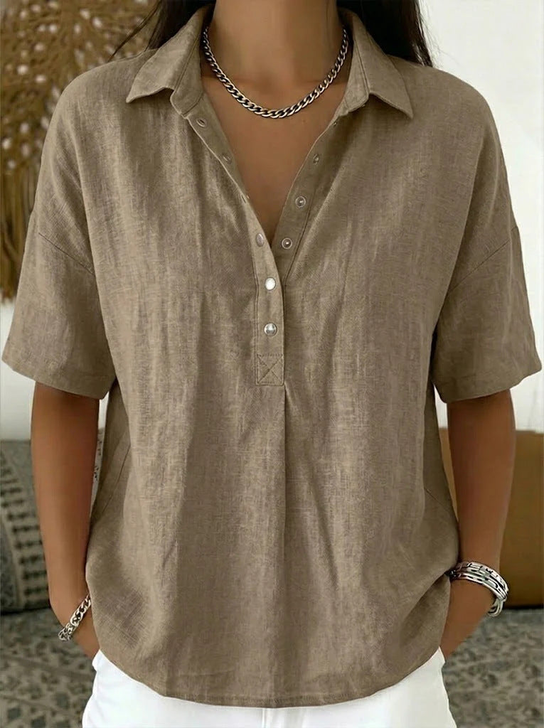 Brown short-sleeve shirt worn by a person with a neutral background