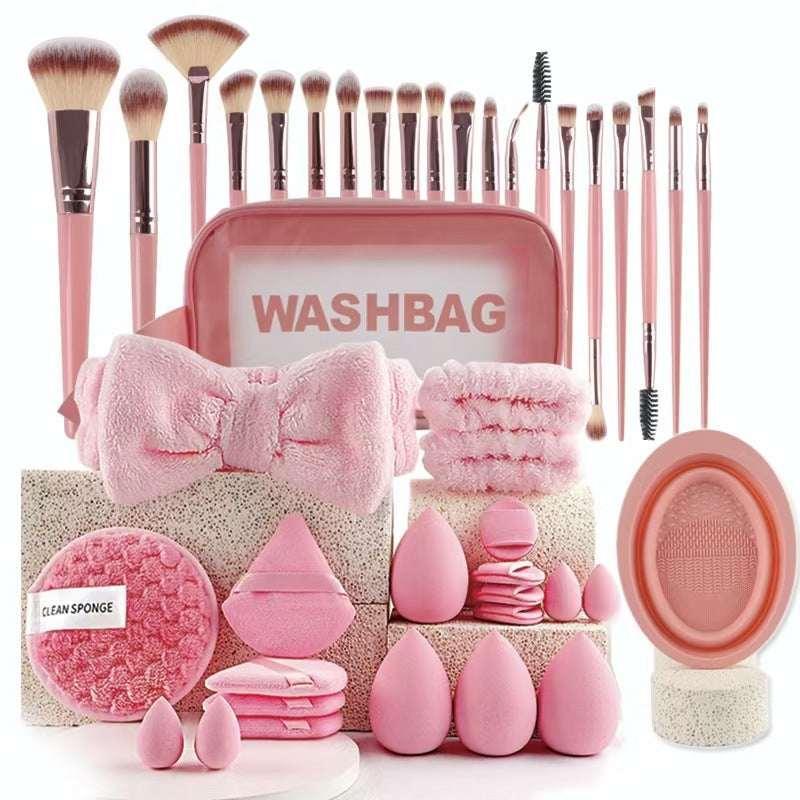 Pink makeup brush set with washbag, beauty sponges, cleansing pads, and headband for women