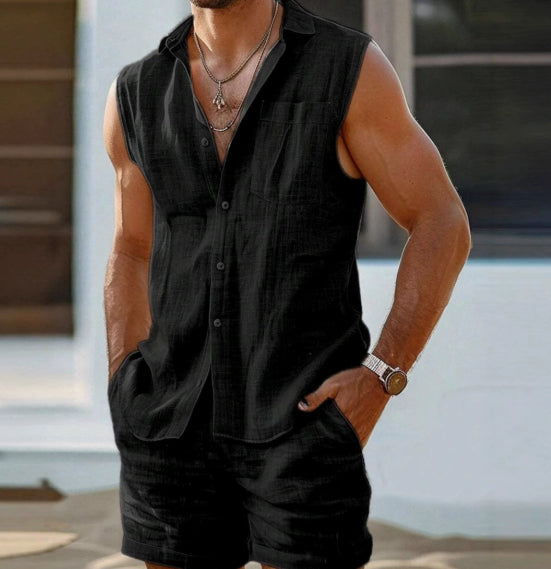 Man wearing a black sleeveless shirt and shorts with a blurred background