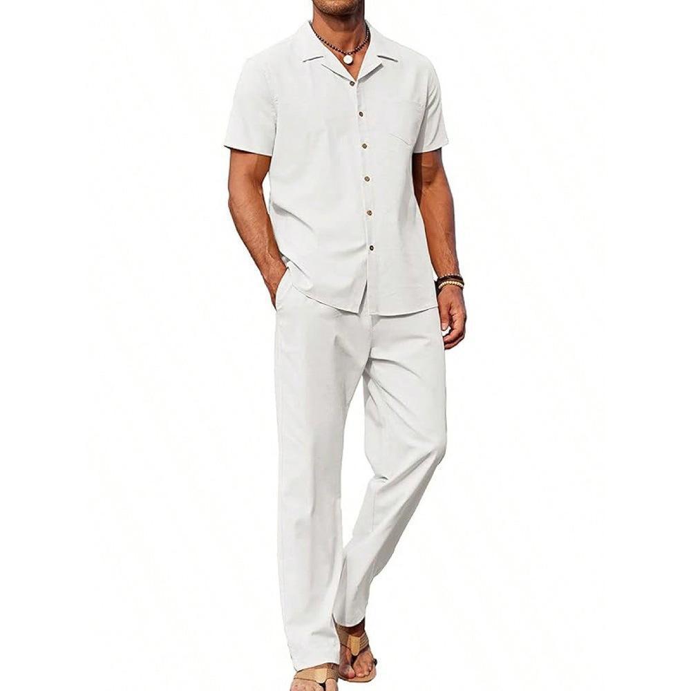 Man wearing a white button-up shirt and pants on a white background