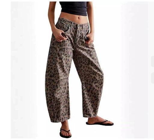 Leopard print pants worn by a person on a white background