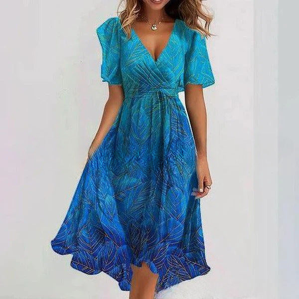 Woman wearing a blue patterned dress on a white background