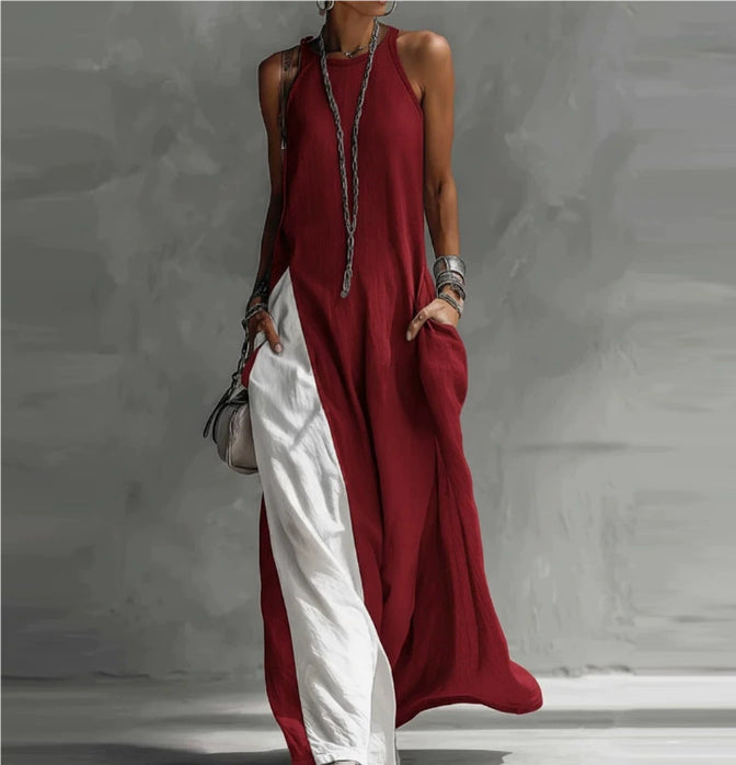 Person wearing a red and white dress against a gray background
