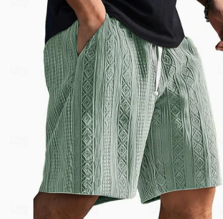 Green patterned shorts worn by a person