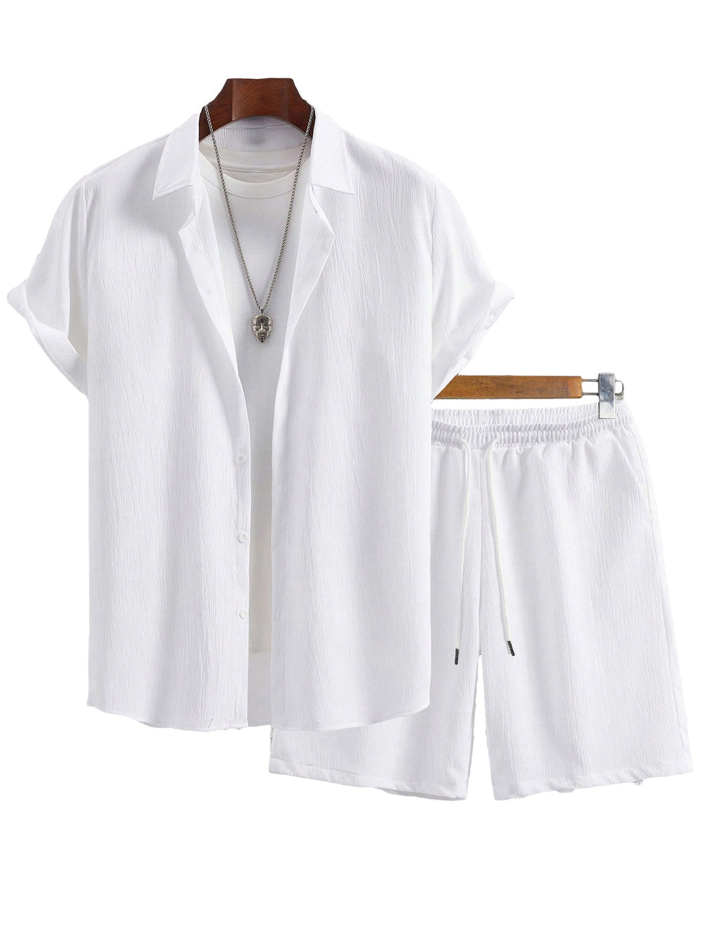 White shirt and shorts set on a hanger against a white background