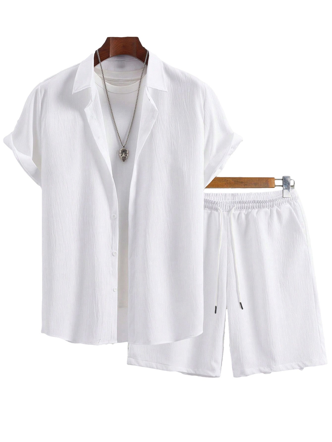 White shirt and shorts set on a hanger against a white background