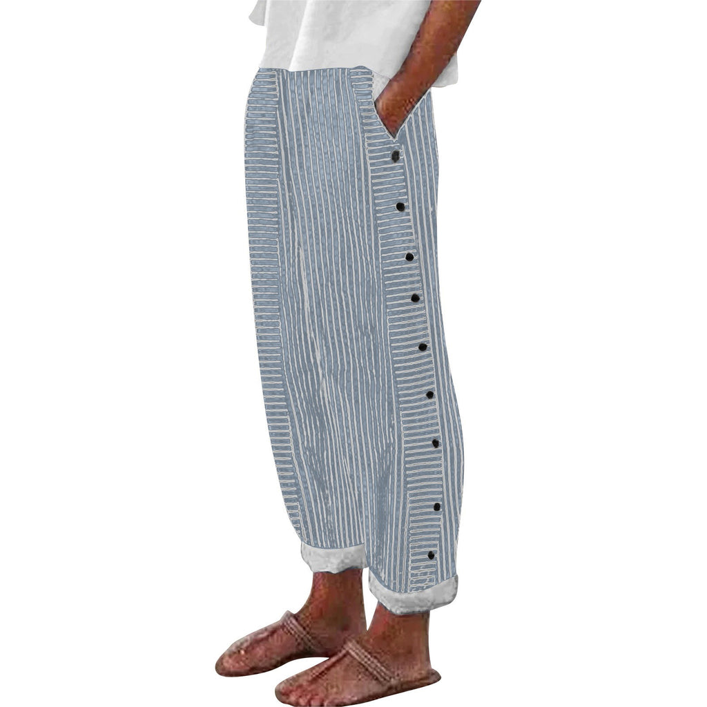 Striped pants with buttons worn by a person on a white background