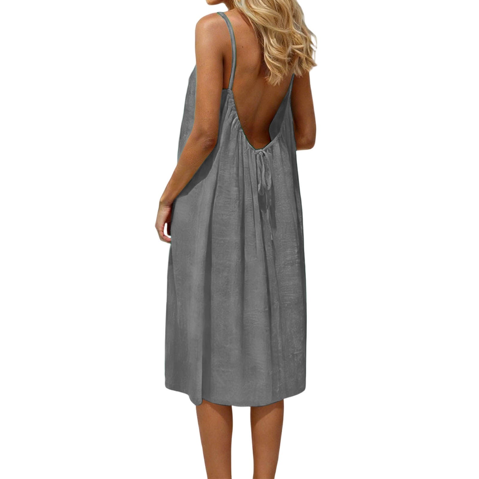 Gray sleeveless dress with open back worn by a person on a white background