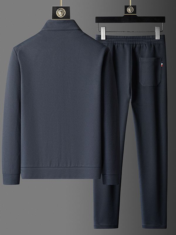 Men’s dark grey textured tracksuit set with long sleeves and pants on hangers