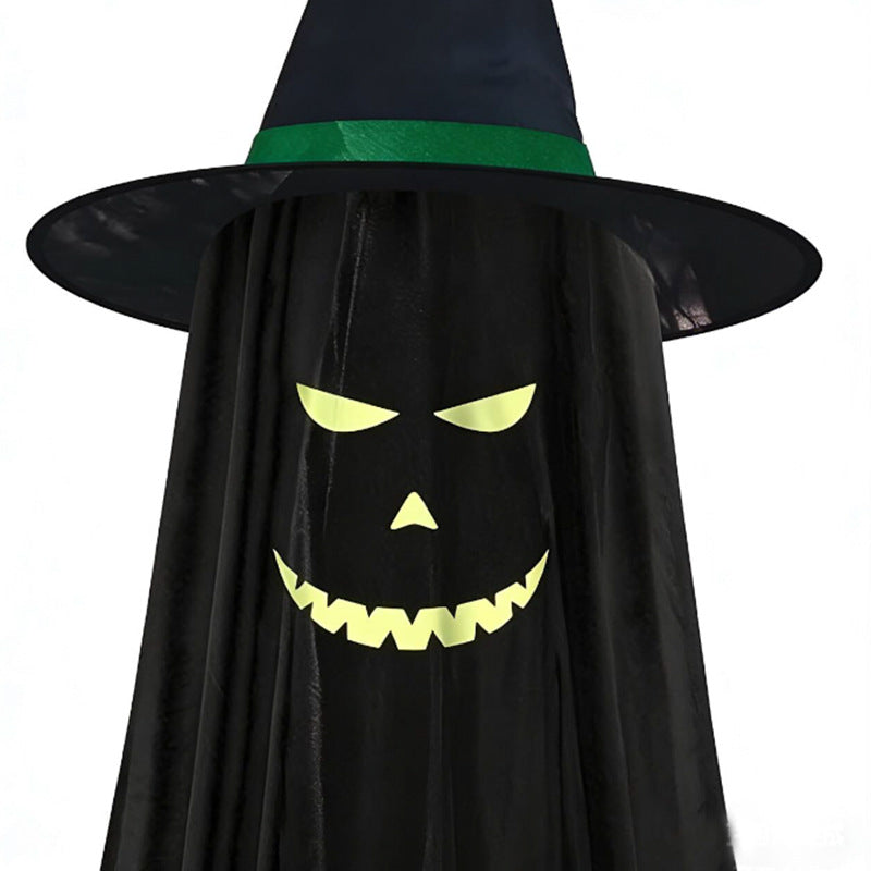 A black ghost Halloween costume with a pointed black hat featuring a green band and a printed glowing yellow jack-o'-lantern face on the front, shown against a plain white background.