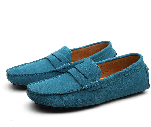 Pair of blue loafers on a white background