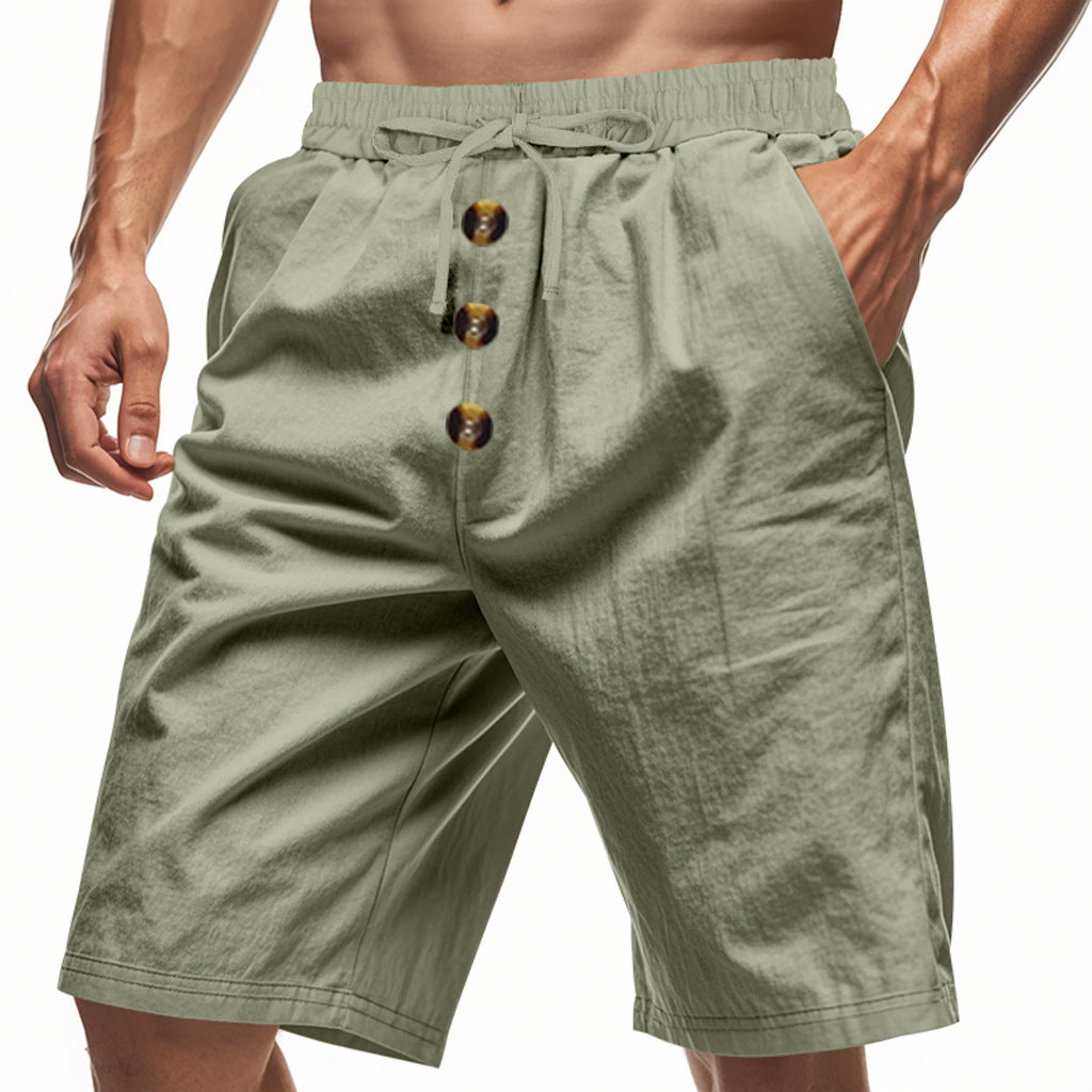Green shorts with button details on a white background