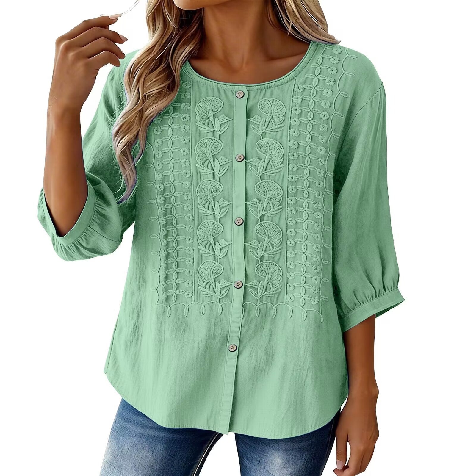 Green lace-up blouse worn by a model on a white background