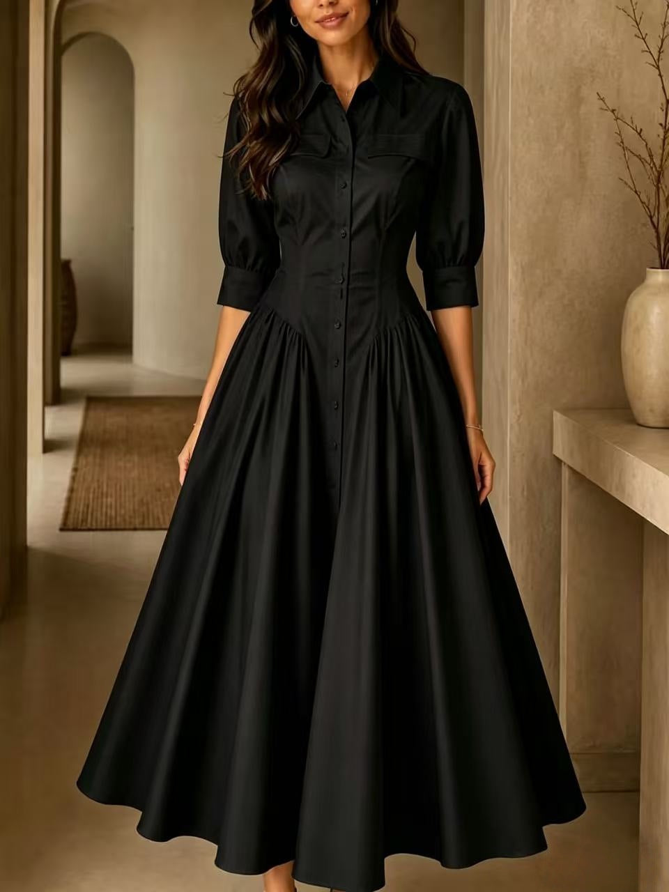 Woman wearing a black dress in an indoor setting
