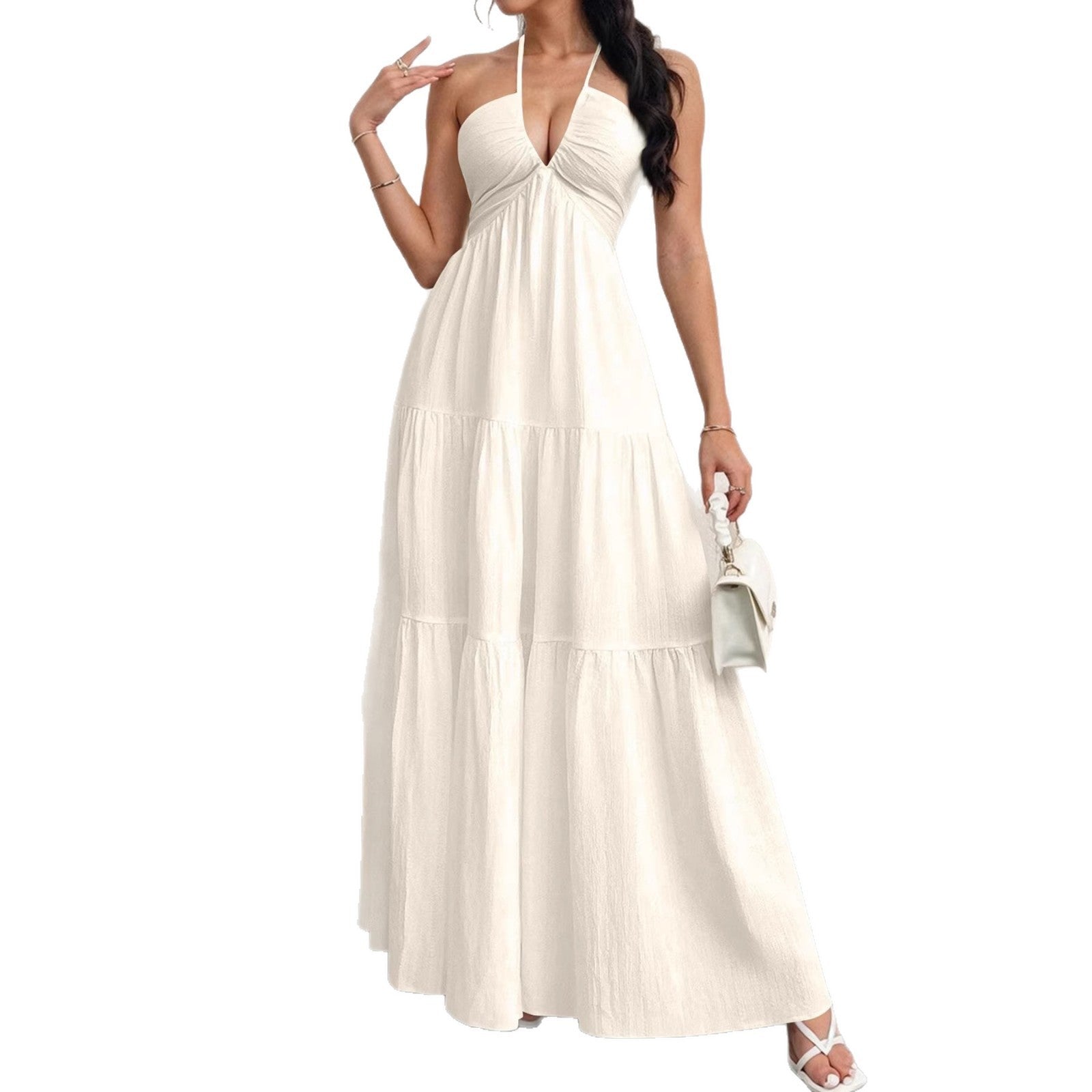 Woman wearing a white halter neck dress on a white background