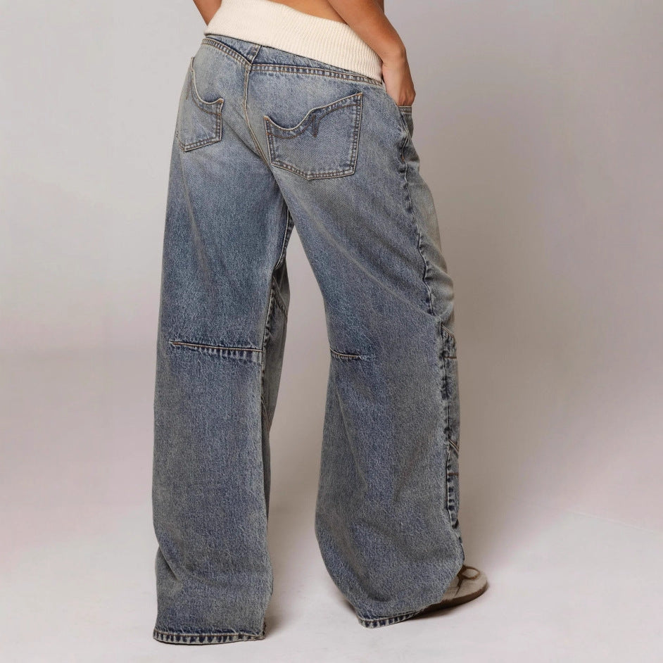 Wide-leg jeans worn by a person on a plain background