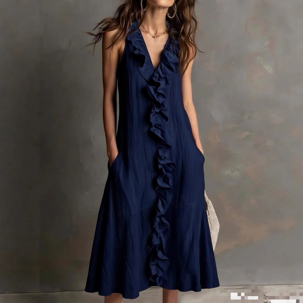 Navy blue ruffled dress worn by a model against a neutral background