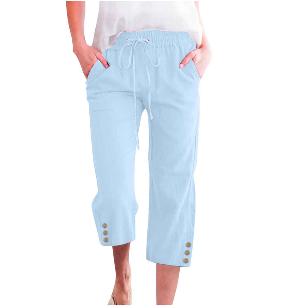 Light blue capri pants with buttons on a white background