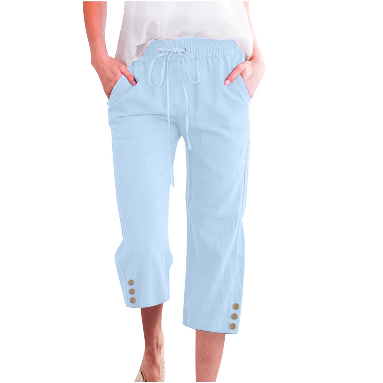 Light blue capri pants with buttons on a white background