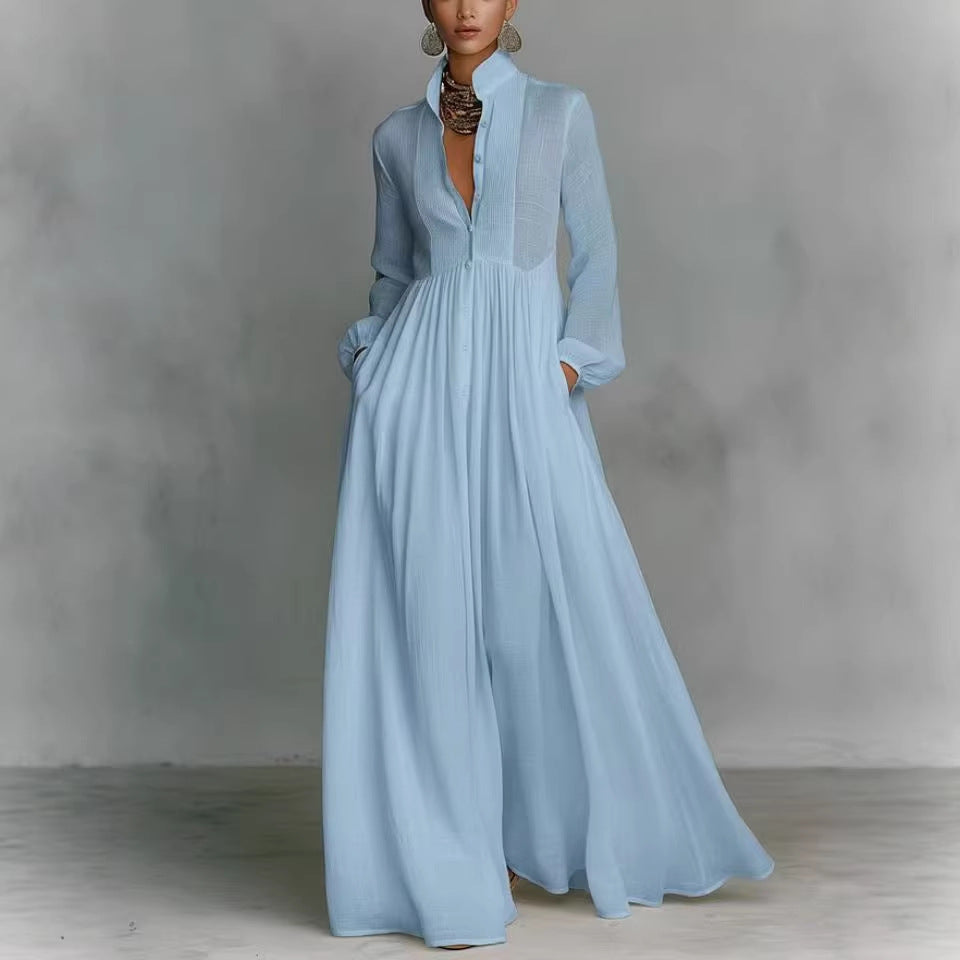 Light blue dress with long sleeves on a gray background