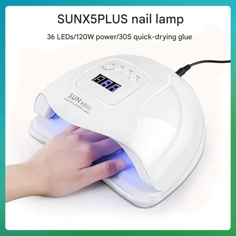 Hand under SUNX5PLUS nail lamp with LED display for quick gel nail drying