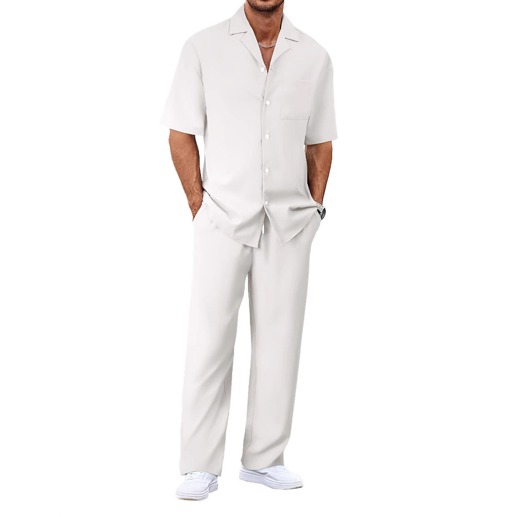 Man wearing a white shirt and pants on a white background