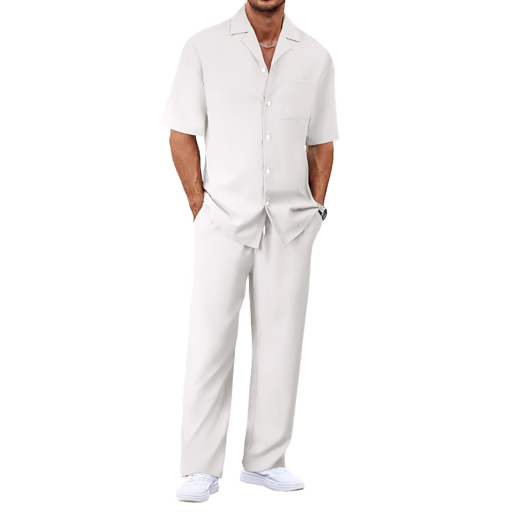 Man wearing a white shirt and pants on a white background
