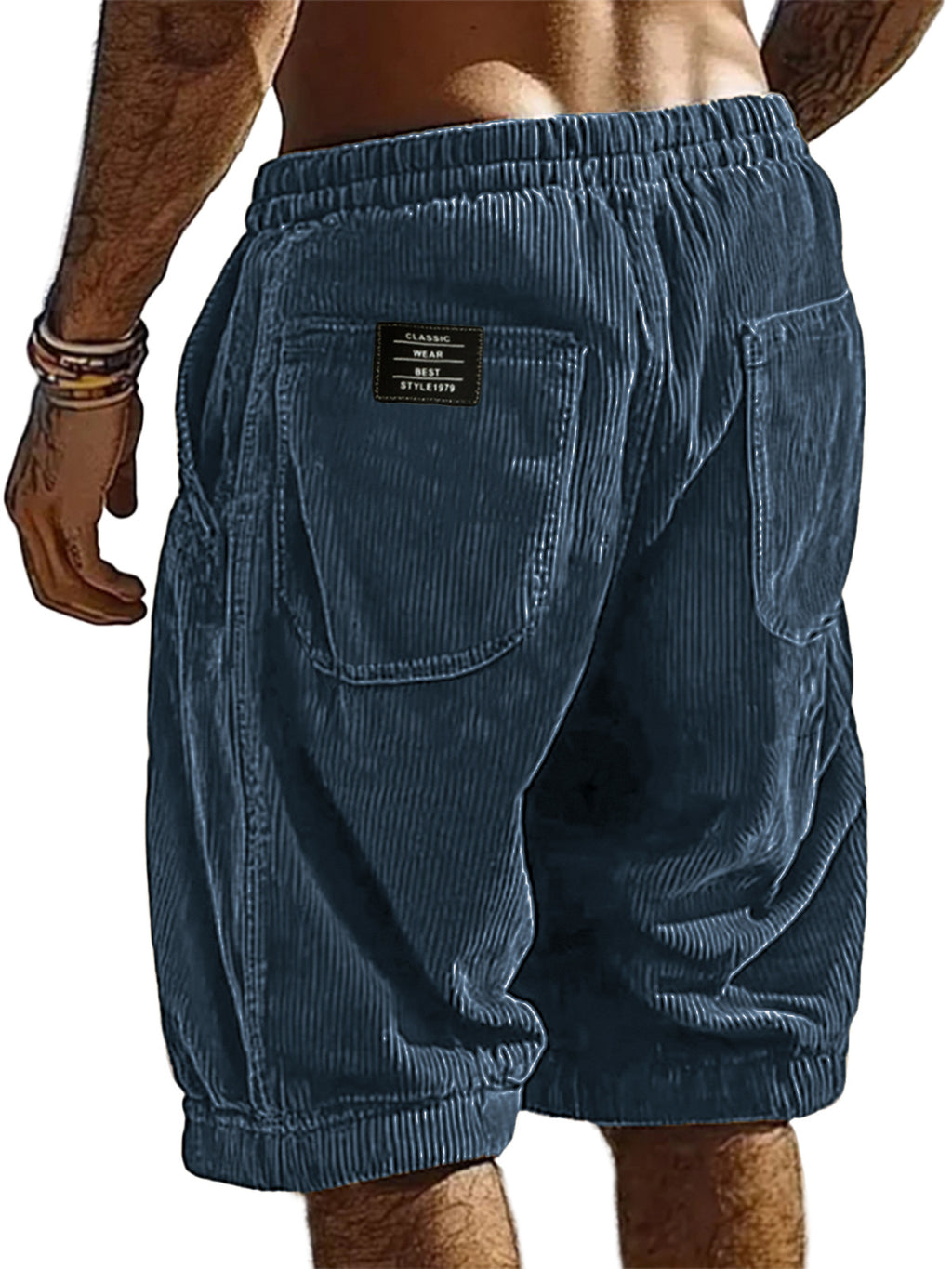 Blue corduroy shorts worn by a person on a white background