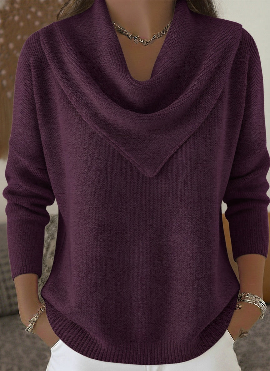Purple sweater worn by a person with a neutral background