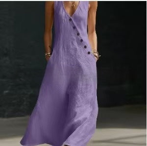 Purple dress with button details worn by a person against a dark background