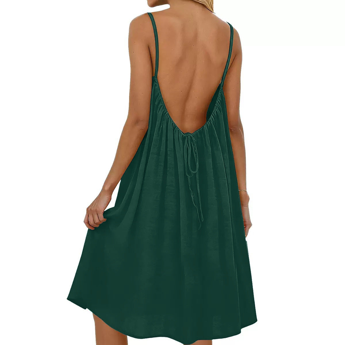 Green dress with open back on a white background