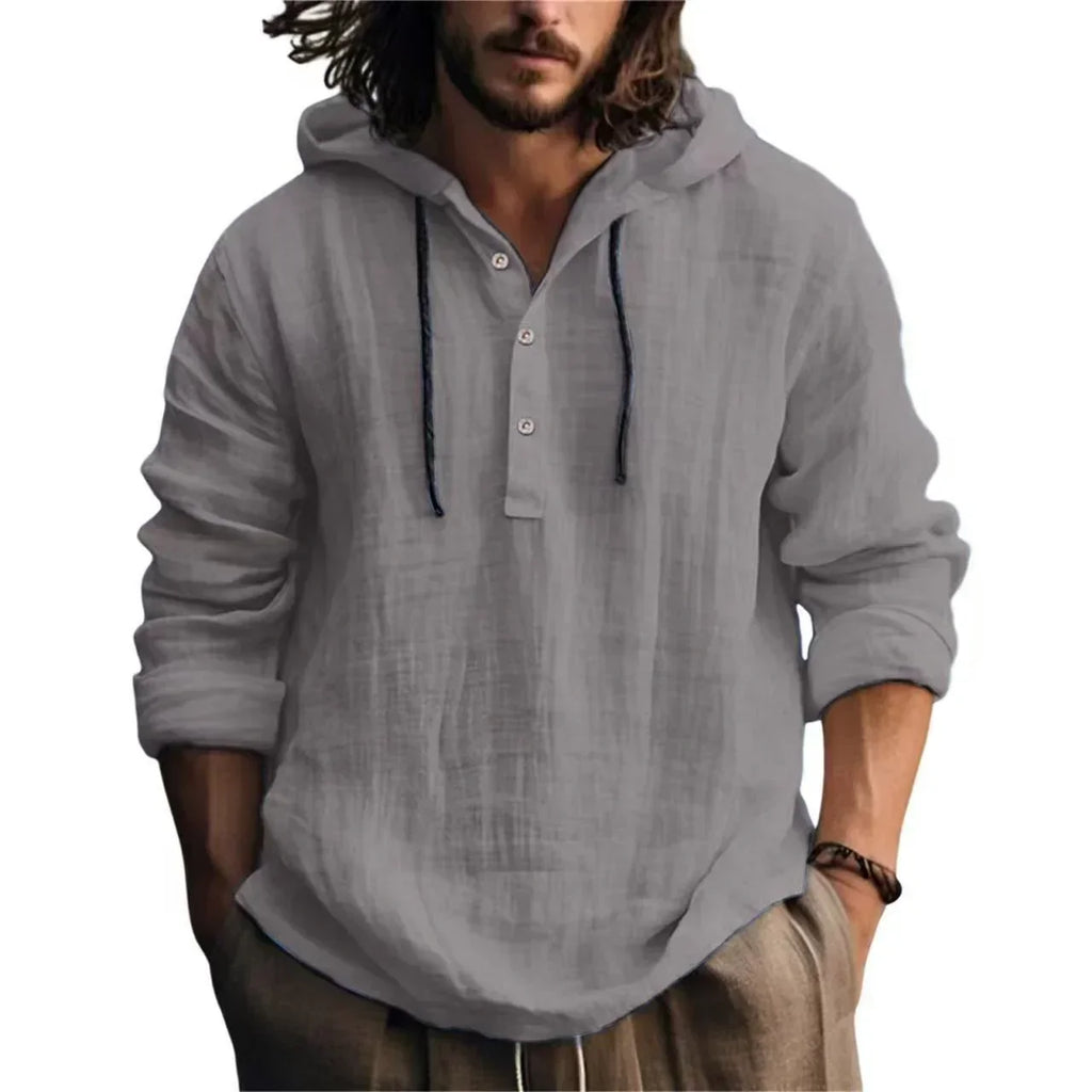 Man wearing a gray hooded shirt on a white background