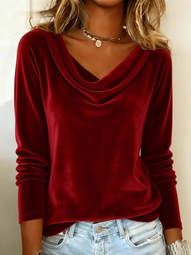 Red long-sleeve top worn by a person with a neutral background