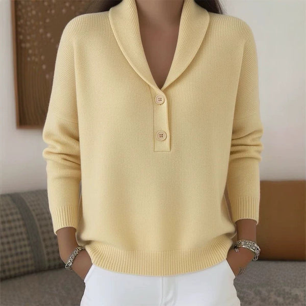 Yellow sweater worn by a person with a blurred background