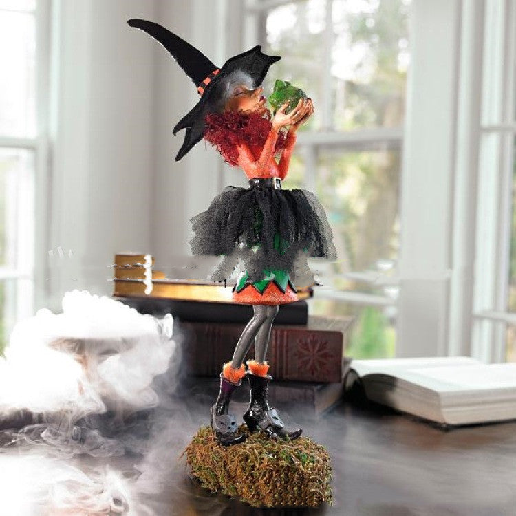 Halloween-themed figurine of a witch blowing smoke rings on a table.
