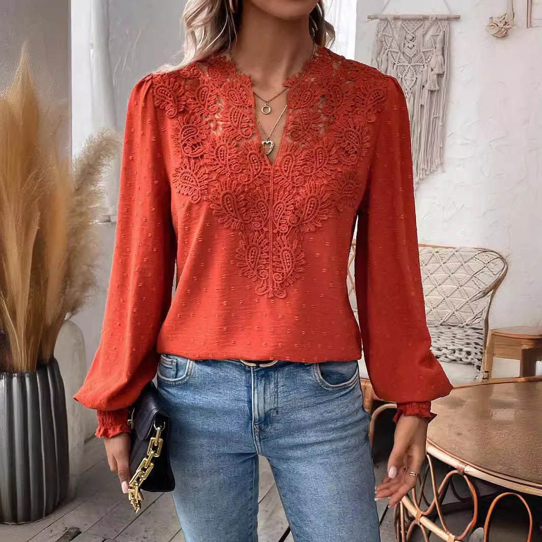 Person wearing an orange lace top and blue jeans in a home setting