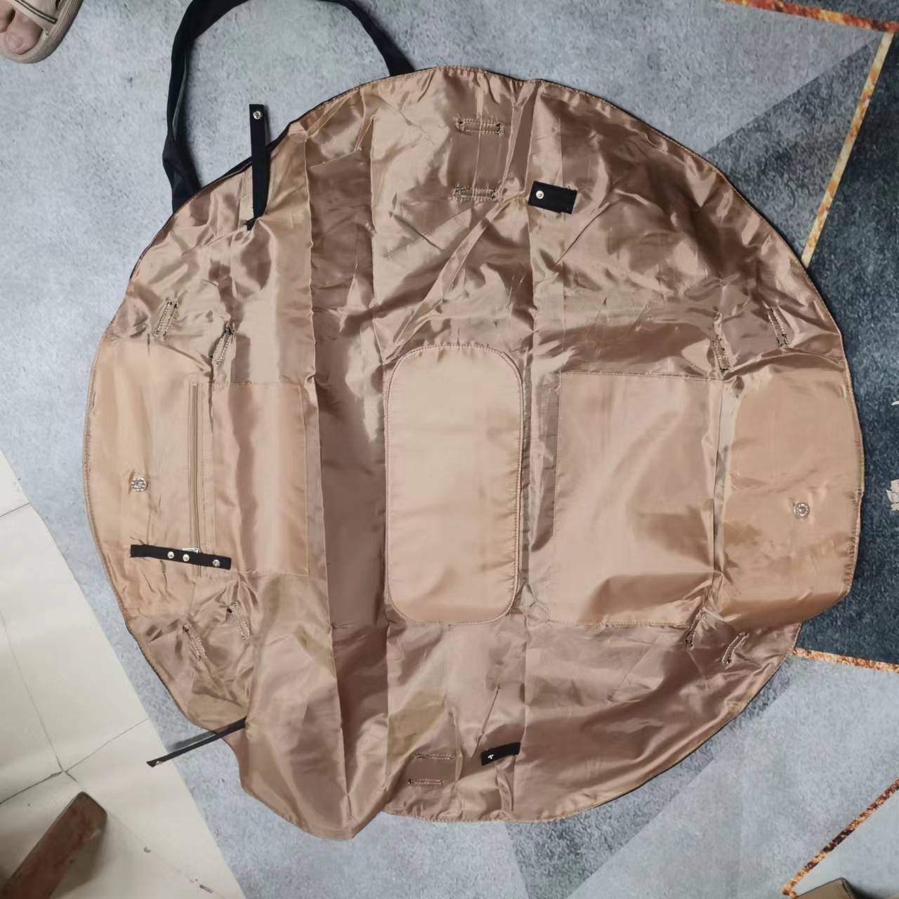 Brown round garment cover on a textured floor