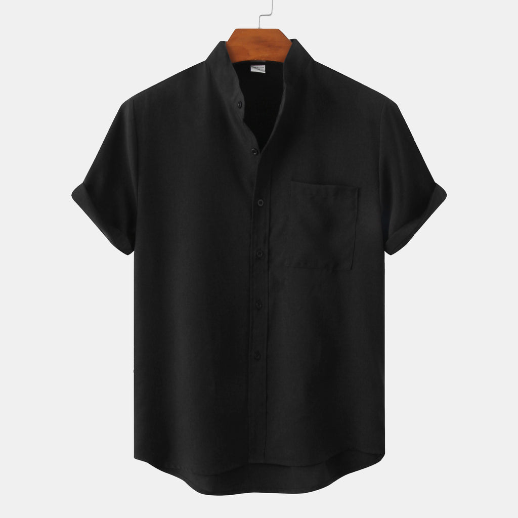 Black short-sleeve shirt on a wooden hanger against a white background