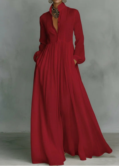 Red long-sleeve dress with a high neckline on a plain background