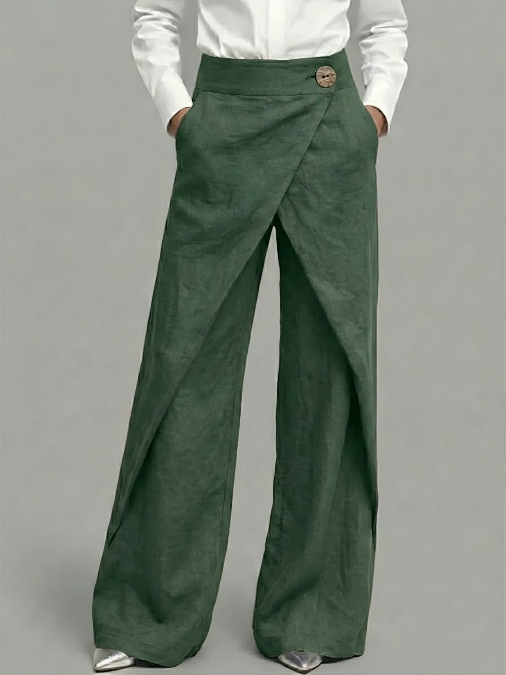 Green wide-leg pants worn by a person on a gray background