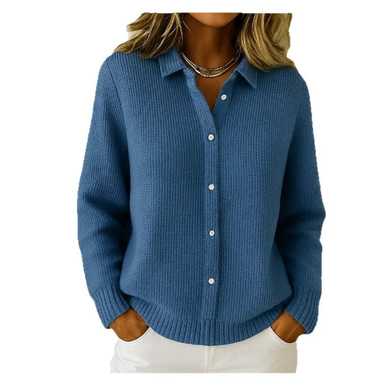 Blue button-up sweater worn by a person on a white background