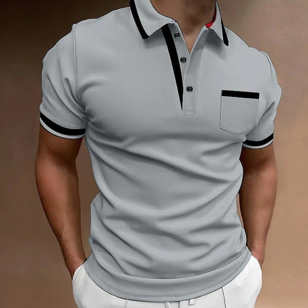 Gray polo shirt with black accents on a brown background