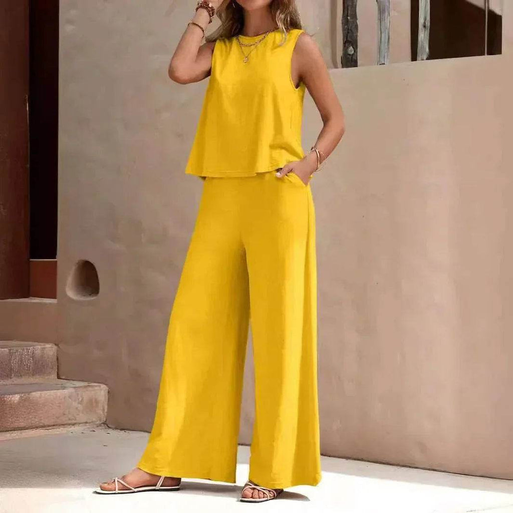 Woman wearing bright yellow sleeveless top and wide-leg pants, stylish ZA-Zola fashion.