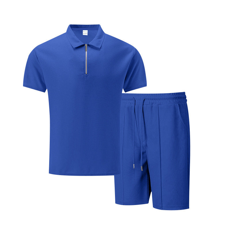 Blue polo shirt and shorts set on a white background