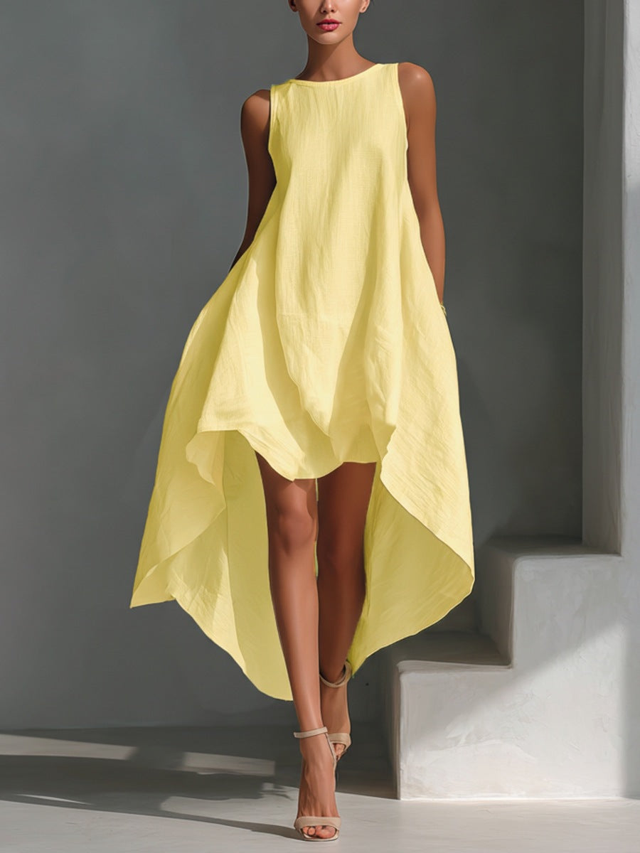 Woman wearing a yellow dress against a gray background
