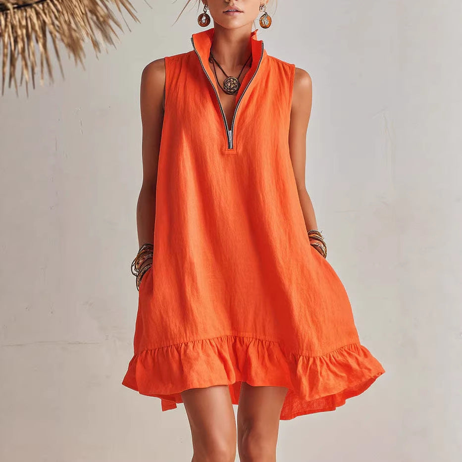 Orange sleeveless dress worn by a person against a neutral background