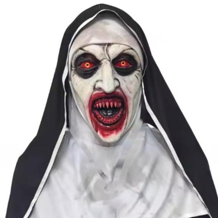 Horror-themed nun mask with white face, black hood, and red eyes on a white background