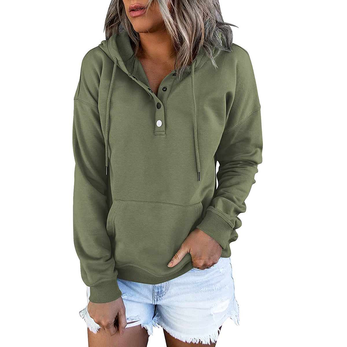 Person wearing a green hoodie with a white background