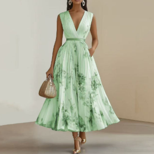 Woman wearing a green floral dress against a neutral background